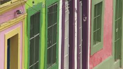 Neighborhood houses feature pastel colored windows and doors in Recife, Brazil. Stock Footage