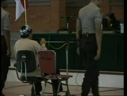 Second defendant appears, Australian testifies News Clip