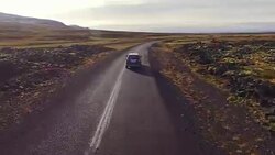 AERIAL Car driving through a countryside of Iceland Stock Footage