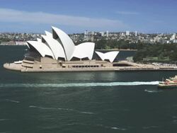 The Opera House with Ferry Boats passing, Sydney, New South Wales, Australia Stock Footage