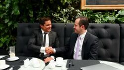 MS Smiling business executives shaking hands after lunch meeting in restaurant Stock Footage