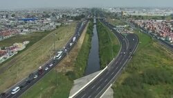 A highway system running along water canal in overpopulated Ecatepec, Mexico. Stock Footage