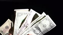 Slow Motion of Counting US Dollar Money With Black Background Stock Footage
