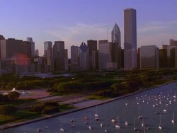 Aerial over Lake Michigan, Adler Planetarium, Monroe Harbor, Grant Park, and downtown Chicago Stock Footage