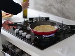 Cooking homemade pita bread. Turkish bezdirme or Indian paratha Stock Footage