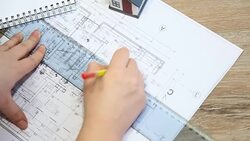 Architect working on blueprint Stock Footage