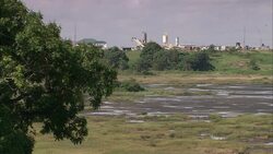 Bulldozers operate on a an asphalt lake in Trinidad. Stock Footage
