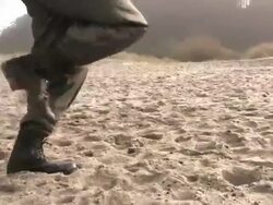 soldiers running on sand steadycam HD Stock Footage