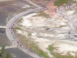 MS AERIAL Shot of tourist watching hot water fountain at Emerald Pool / Wyoming, United States Stock Footage
