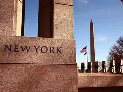 Slow panning shot of New York pillar at the World War II Memorial in Washington DC Stock Footage