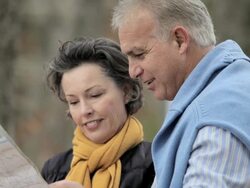 Mature couple looking at map Stock Footage