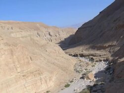 Aerial flight through valley of Wadi Kidron nature reserve at the Dead Sea, Judea Desert, Israel Stock Footage