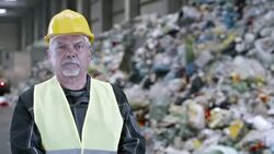 PAN portrait of a recycling facility worker Stock Footage