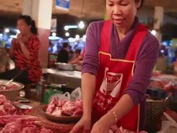 MS POV SLO MO Women vendors weighing meat at meat market / Vientiane, Laos Stock Footage