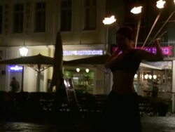 MS TS Female fire dancer dancing on street at night / Dresden, Saxony, Germany Stock Footage
