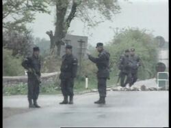 Kosovo - Burial of Albanians/Troops enter region News Clip