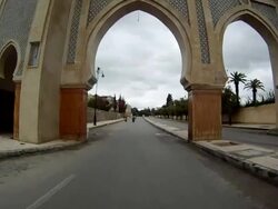 MS POV View of back of car whilst driving through ornate city gates / Fez, Fes-Boulemane, Morocco Stock Footage