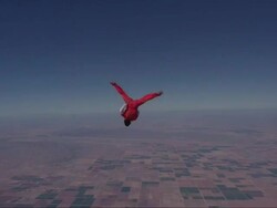 Skydiver exits plane and does a series of flips, layouts and twists. Stock Footage