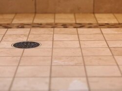 Residential Tiled Shower Drain with Dripping and Draining Water Stock Footage