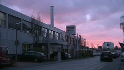 A pink and purple sky glows over a meat processing plant in Frankfurt. Stock Footage