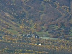 WS ARIEAL View of Sugarloaf Ski Resort, hotel at forest /Maine, United States Stock Footage