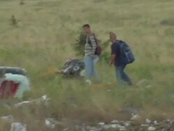 Malaysian air crash investigators at MH17 site News Clip