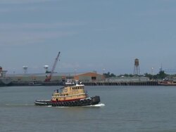 Passing Mississippi tub boat from river point-of-view Stock Footage