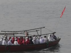 WS Boat full of people floating down river Ganges / Varanasi, India Stock Footage