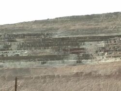 WS ZO Shot of open pit strip mine and equipment destruction (errosion, pollution) / Miami, Arizona, United States  Stock Footage