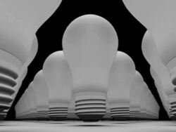 CGI ZI ground level through old bulbs / A bulb glowing and rising, then rising to higher level Stock Footage