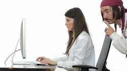 Internet pirate stealing information from a businesswoman working on a computer. Stock Footage