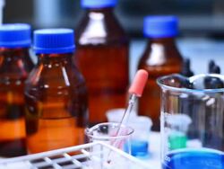 Boiling red liquid in beaker, Dolly shot Stock Footage