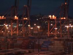 Long Shot tilt-up - Shipping containers fill a container yard at night / USA Stock Footage