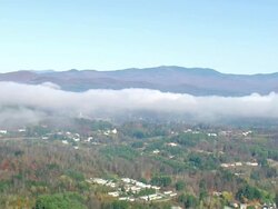 WS AERIA View of Low mist over Montpelier city / Vermont, United States Stock Footage