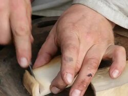 CU Shot of hand cutting up Iceland native rotten shark meat / Reykjavik, Hofudhborgarsvaedhi, Iceland  Stock Footage