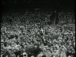 1937: BRITISH FOOTBALL: CU Unidentified male alone, waving. HA TD HUGE crowd in stands, fans. LOCKER ROOM: Unidentified football (soccer) 'players' having rub down, working out in gym, throwing medicine ball, jumping rope, punching speed bag. Instructional Video