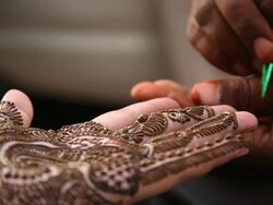 CU R/F Henna tattoo maker making tattoo on woman hand at lajpat nagar / Delhi, India   Stock Footage