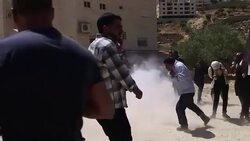 CLEAN : Israeli troops fire tear gas at separation barrier demo News Clip