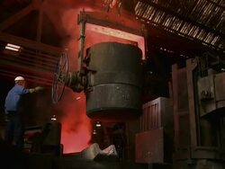 WS ZI  Worker working at inductive heating furnace of foundry / Juenkerath, Rhineland-Palatinate, Germany  Stock Footage