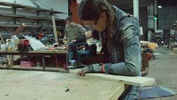 Woman Cutting Wood with Jigsaw Stock Footage