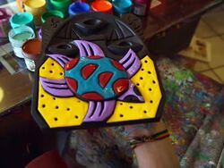MS Shot of painting a mask with various color / Quito, Ecuador Stock Footage