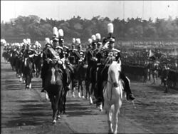 B/W 1940s Emperor Hirohito riding horse past troops + saluting / educational Stock Footage