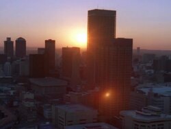Aerial shot of the Johannesburg Central Business District during sunset/sunrise Stock Footage