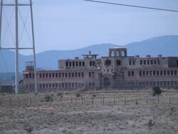 Crime: Abandoned Prison in Barren Desert, Zoom Out Stock Footage