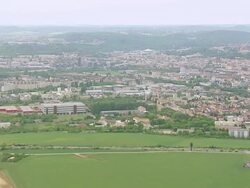 WS View of green field and buildings / Brno, Brno City District, Czech Republic Stock Footage