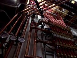Wire and pipe system in a 'zero net energy' home's basement Stock Footage