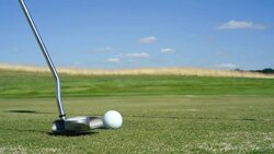 strikes the golf ball Stock Footage