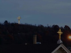 Illuminated cross on hilltop dusk timelapse HD Stock Footage
