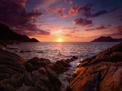 Sunset at Rocky Coastline Stock Footage
