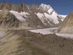 WS AERIAL View over debris covering Unteraar Glacier with huge medial moraines with Summit of Lauteraarhorn / Unteraar Glacier, Bern, Switzerland Stock Footage